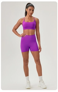 Detailed view of high-waist purple yoga shorts with a seamless and breathable athletic fit