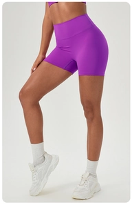 Close-up of seamless dark purple high-waisted gym shorts for yoga and running