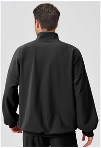 Rear view of men's black sports sweatshirt featuring drop shoulder design and ribbed cuffs