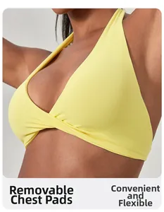 Détail du soutien-gorge de sport dos nu jaune avec coussinets amovibles et ourlet croisé