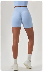 Detail view of light blue high waist sports shorts with scrunch butt lifting design