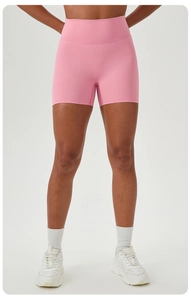 Close-up of high-waist yoga shorts in pink with elastic seamless fit for fitness