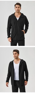 Détail de la veste de sport noire à capuche pour homme avec fermeture éclair et stretch