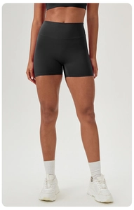 Close-up of high waist yoga shorts in black matte fabric with seamless compression fit