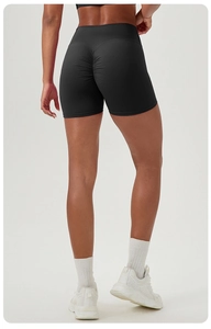 Detail shot of black high-waisted scrunch butt gym shorts showing lifting fabric texture