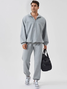 Men's loose grey half-zip tracksuit set with long sleeve sweatshirt and joggers