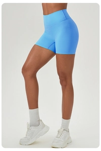 Detail of high-waisted peach butt yoga shorts with seamless knitting and elastic fabric