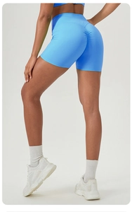 Close-up of sky blue high-waist yoga shorts featuring a scrunch butt lifting design