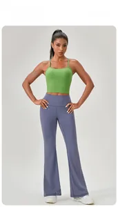 Top yoga a coste verdi e pantaloni svasati blu per set da fitness sportivo da donna