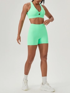 Neon green high waist yoga shorts and V-neck sports bra set for fitness and running