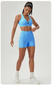Close-up of sky blue sports bra featuring hollow twist design and high-elasticity fabric