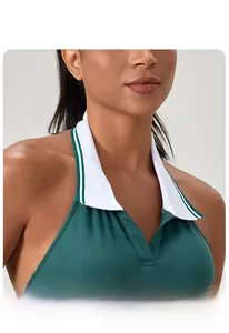 Detail of dark green halter tennis dress featuring a white contrast polo collar and stitching