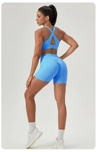 Detail of bright blue yoga set with racerback bra and high-waist shorts for fitness