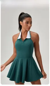 Close-up of halter neck tennis dress with contrast white collar and dark green fabric