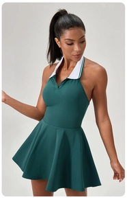 Detail of dark green backless tennis dress with a white polo collar and A-line skirt cut