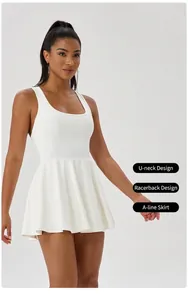 Detail view of white tennis dress showing U-neck, racerback and pleated A-line hem