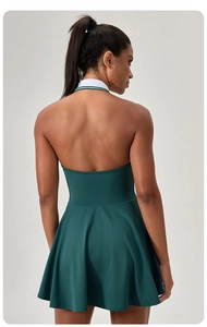 Rear view of haltered sports dress showing open back design and A-line skirt fit