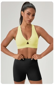 Close-up of lemon yellow sports bra with front hollow-out and cross-pleated design