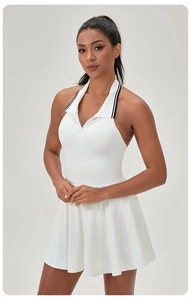 Close-up of white halter tennis dress with contrast collar and pleated athletic hem