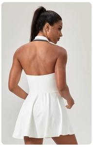 Rear view of white backless halter tennis dress with contrast striped rib collar detail