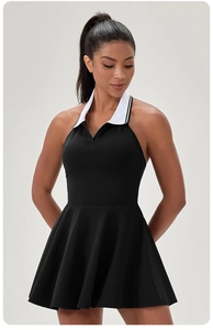 Detail of the halter polo neck design and contrast white collar on this black tennis dress