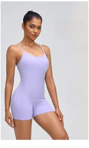 Detail view of the ergonomic seams and high-stretch lilac fabric on this yoga bodysuit