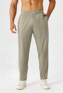Detail showing elastic waist and durable high-stretch fabric on men's khaki jogger pants