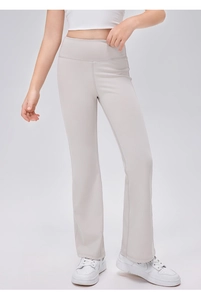 Detailansicht der grauen Schlag-Yogahose für Mädchen mit hohem Bund und Stretchstoff