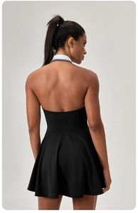 Back view of backless tennis dress with contrasting striped halter collar detail