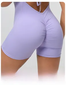 Detail showing scrunch butt seam and tie-back design on purple yoga romper