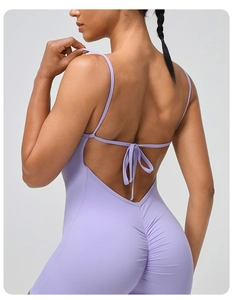 Detail of lavender backless yoga romper with lace-up straps and ruched peach butt lifting