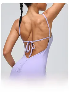 Close-up of the lavender backless yoga romper featuring lace-up straps and ruched butt detail