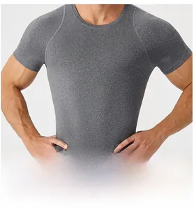 Detail of grey compression t-shirt showing raglan sleeves and tight athletic fit on torso