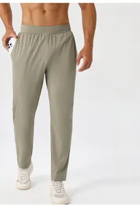 Detail showing high-elasticity khaki sports pants with side pocket and breathable fabric