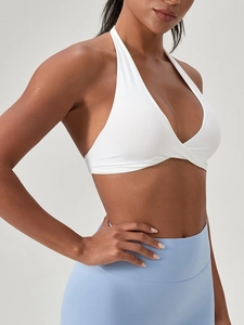 Brassière de sport licou blanche avec nœud et legging de yoga bleu à taille haute