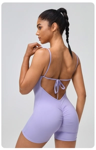 Detailed back view of light purple yoga bodysuit with thin straps and lace-up design
