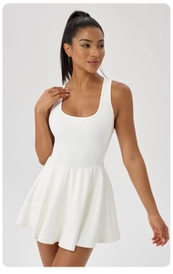 Detail of a white sleeveless pleated athletic dress with a slim fit for tennis or golf