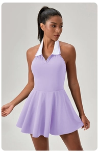 Detail of lavender halter tennis dress featuring contrast white polo collar and pleated hem