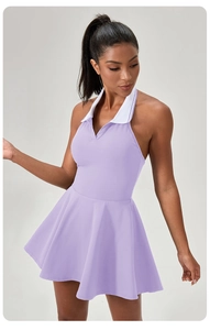 Detail of purple tennis dress with halter neck, contrast collar and pleated A-line skirt