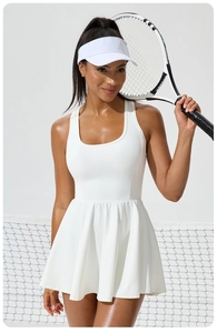 Detailed view of white pleated tennis dress with U-neck design for professional sports