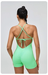Detail of cross back straps and scrunch butt design on mint green yoga romper