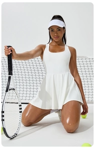 Detail of white pleated tennis dress with racerback design and high elasticity fabric