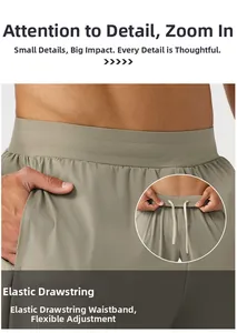 Detail of olive green athletic pants showing elastic waistband and adjustable drawstring