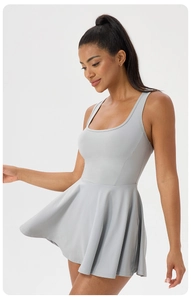 Back view of high-elastic light grey tennis dress with racerback and pleated skirt detail