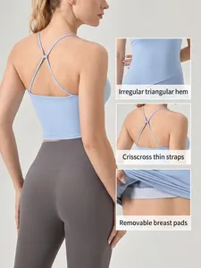 Canotta yoga blu con spalline incrociate, orlo triangolare e imbottiture rimovibili