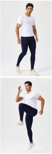 Detail of compression sportswear set featuring white slim fit t-shirt and navy leggings