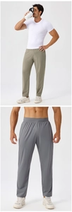 Detail of men's quick-dry sports trousers featuring elastic waistband in olive and grey colors