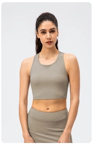 Detail of high-stretch ribbed fabric on olive green two-piece yoga set for women