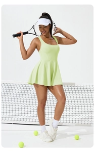 Detail of light green tennis dress with pleated hem, athletic sleeveless design