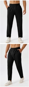 Close-up of black quick-dry men's sports pants with high elasticity and breathable fabric